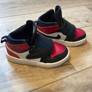 Used kids sneakers. 11c. Good condition red black white. Skyjordan